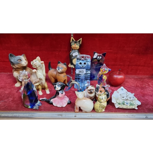 363 - A collection of fifteen cat figurines, including a turquoise blue hand blown glass cat, a heavy marb... 