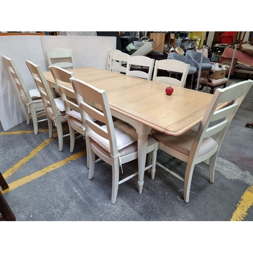 391 - A 11 piece, beechwood Dining Room suite including 10 chairs and a extendable dining table. The chair... 
