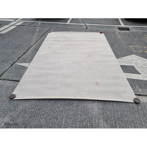 397 - A large room rug with a thickly woven carpet in an oatmeal shade. 2m x 3m.