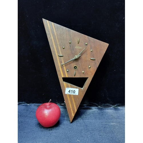 410 - A very unusual and stylish mid-century Luwoha teak wall clock with a pierced triangular wooden base ... 