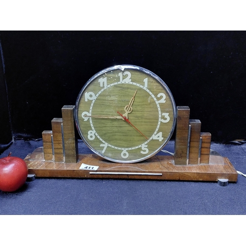 411 - A stunning electric Art Deco clock by brand ''Hammond'' with sconced shoulders, chrome details and a... 
