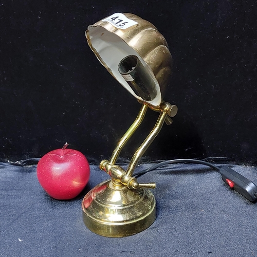 415 - A brass toned adjustable desk lamp with a pretty shell shaped head.