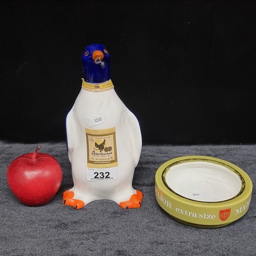 232 - Two ceramic items including an Okhotnichya hunters vodka bottle in the shape of a penguin and a Majo... 