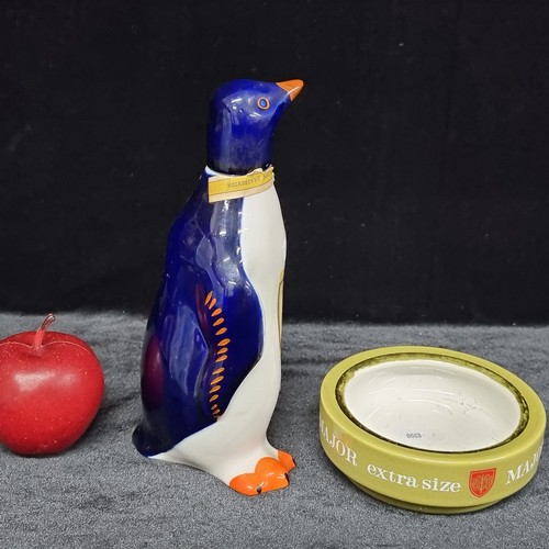 232 - Two ceramic items including an Okhotnichya hunters vodka bottle in the shape of a penguin and a Majo... 