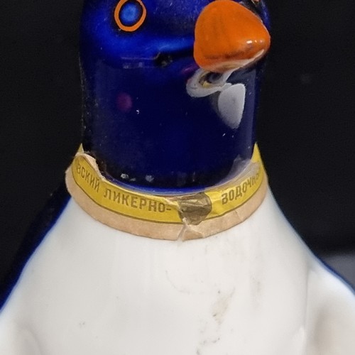 232 - Two ceramic items including an Okhotnichya hunters vodka bottle in the shape of a penguin and a Majo... 
