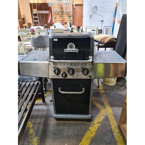 401 - A Broil King gas powered barbecue with storage underneath, gas ring on the left. space either side f... 