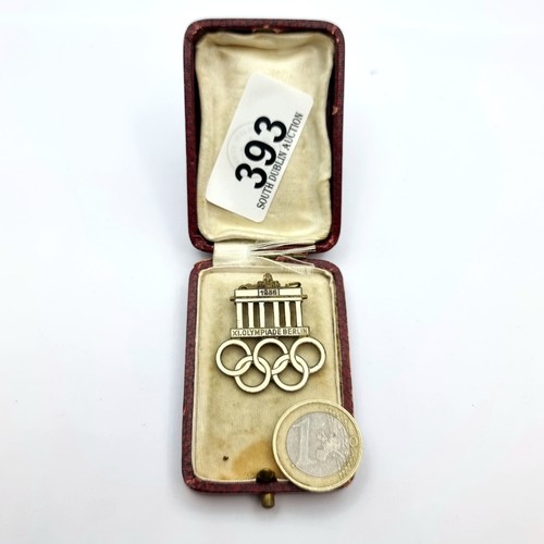 393 - A rare 1936 original Berlin Olympics badge, pin intact, with the 5 rings and a vintage box.