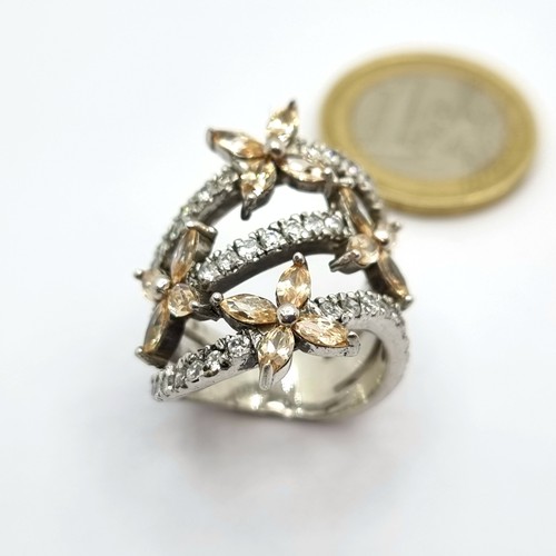 201 - Large Sterling Silver gem set ring with flowers, size N 9 grams.