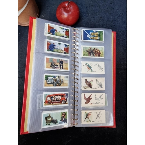 364 - A huge, very fine album of vintage cigarette cards. All in great collection and neatly organized ins... 
