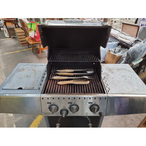 401 - A Broil King gas powered barbecue with storage underneath, gas ring on the left. space either side f... 