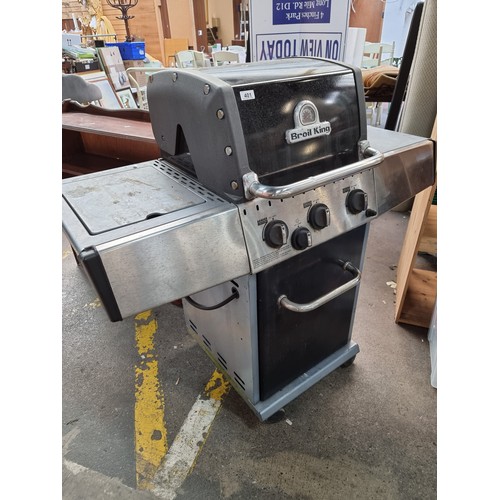 401 - A Broil King gas powered barbecue with storage underneath, gas ring on the left. space either side f... 