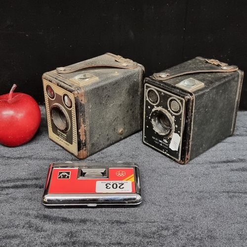 203 - Three vintage items, including two brownie box 620 cameras (Model C 1946 and D 1948). Together with ... 
