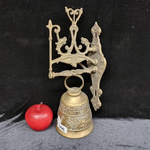 206 - A stunning brass wall mounting bell and pull chain, With foliate detail and inscribed 