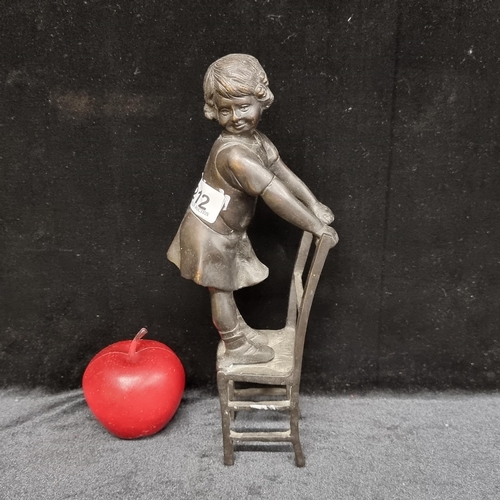 212 - A vintage heavy Bronze statue of a little girl balancing on a chair. A super quality piece and heavy... 