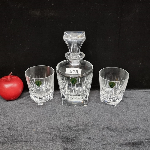 215 - Three Waterford Crystal items, including a pair of tumblers and a heavy decanter. With very cool yet... 