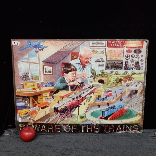 116 - An unusual print on metal sign showing a grandfather and son playing with model trains with the capt... 