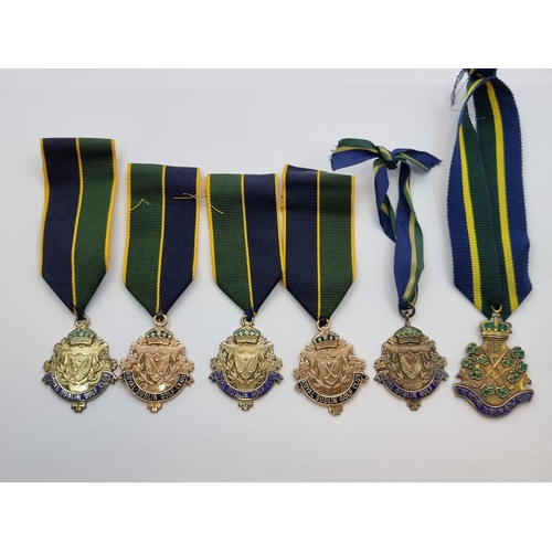 4 - A collection of six Royal Dublin Golf Club medals, set in Irish silver All with ribbons attached, in... 