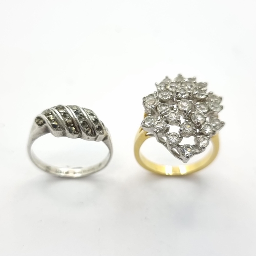60 - Two rings, a huge display gold tone cluster ring (size L, weight 4.65g) and a sterling silver channe... 
