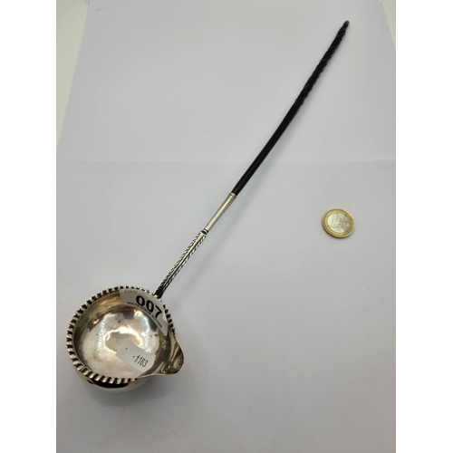 7 - A very attractive antique toddy ladle. With piecrust rim and lip finish, together with ebonised twis... 