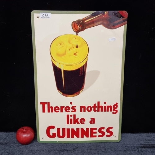 86 - A large metal advertisement sign for Guinness with the slogan 