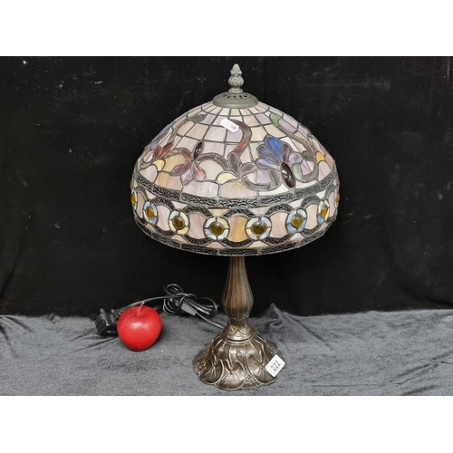 222 - A large beautiful table lamp with tiffany style shade in stained glass colours of mauve , amber and ... 