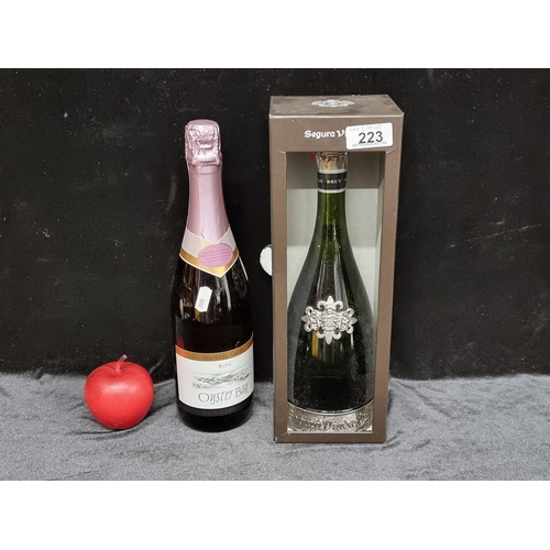 223 - Two items including a bottle of Segura Vudas brut Reserva cava (75cl) in presentation case along wit... 