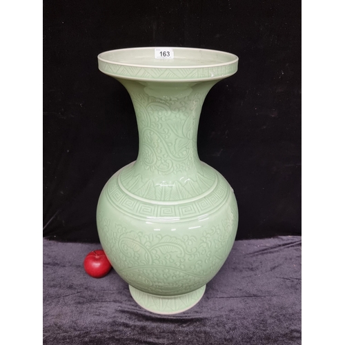 163 - A very large 20th century Chinese celadon vase in the Tianqiuping (gobular) shape with profuse flora... 