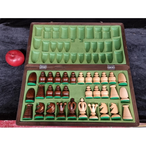 172 - A lovely large two toned wooden complete chess set, with hand carved pieces and presented in a porta... 