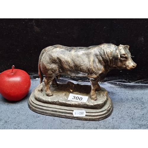 300 - A cast bronze statue of a fine looking bull on a pedestal base.