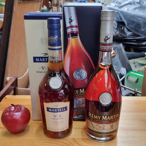 386 - Two 70cl bottles of Fine Cognac including a bottle of Remy Martin and Martell VS Fine Cognac.