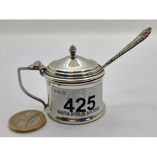 425 - An attractive sterling silver mustard pot with Bristol blue liner. Hallmarked Birmingham 1909, maker... 