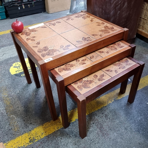 510 - A set of 3 tier 1960's mid century nesting tables with terracotta tiles on the top with berry and le... 