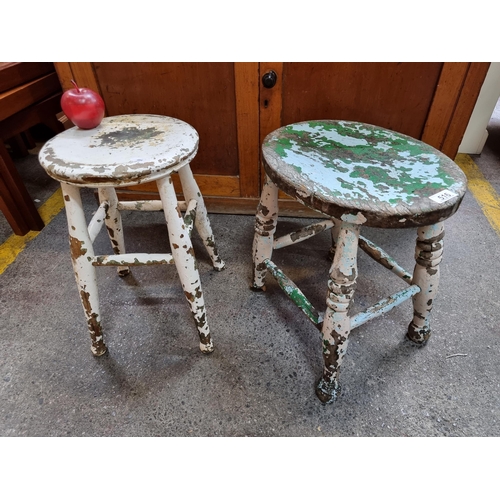 516 - Two vintage wooden stools, one oval and one circular, with turned legs and stretcher. Great age to t... 