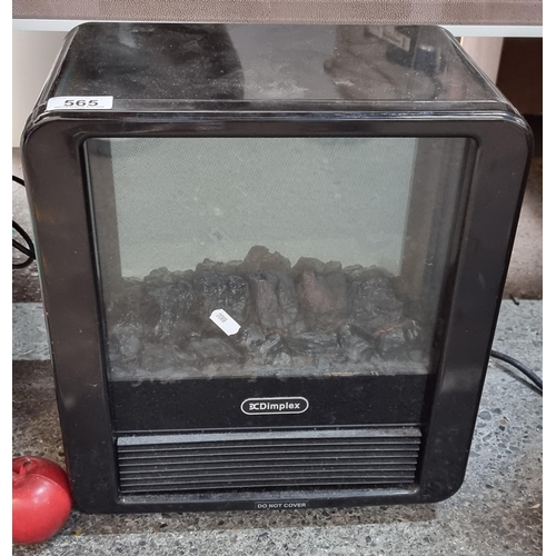 565 - A neat size Dimplex storage heater, with a classic fireplace design. Model MCF15B