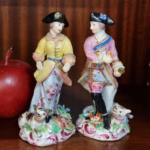 572 - Very nice pair of 19th century Staffordshire figures of a man and a woman dressed in 18th century ga... 