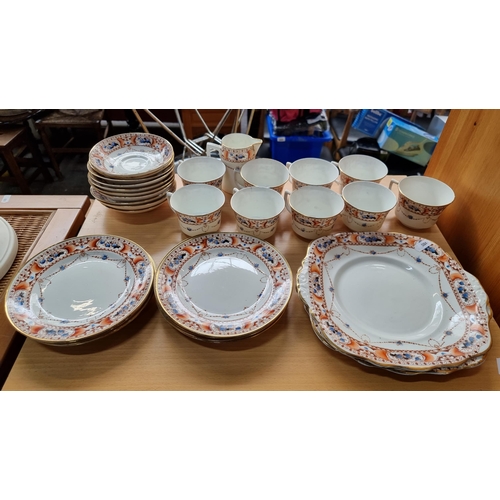 585 - 31 pieces of Warwick china tea set with hand painted neoclassical design with gilt edges.