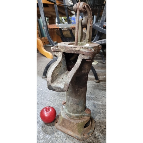 642 - An antique cast metal water pump H50cm.