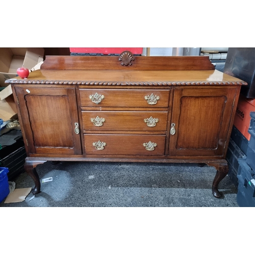 652 - A fabulous red mahogany  handsome Edwardian  sideboard. With three central drawers and two flanking ... 