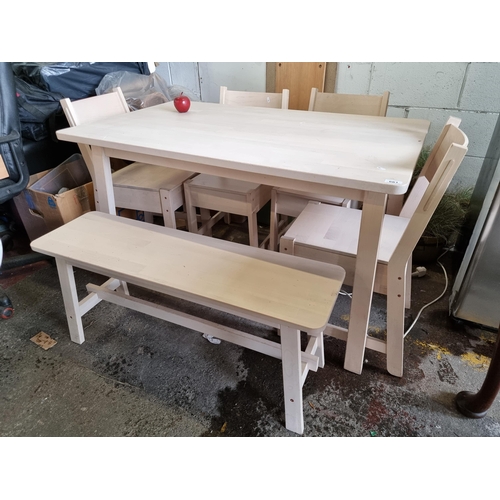 661 - A wooden table with rounded edges and cream finish with a matching bench and four matching chairs. H... 