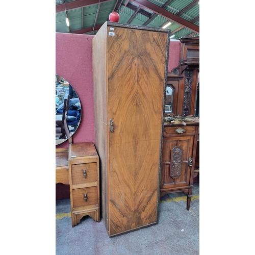 748 - A very tall early 1900s walnut cupboard with 7 interior drawers the top two having glass fronts.  Al... 