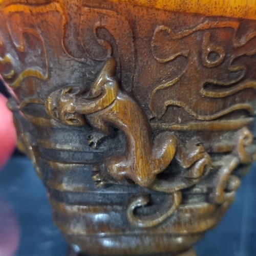 617 - A Chinese libation cup, with seven lively chilongs in relief clambering along the rim and exterior. ... 