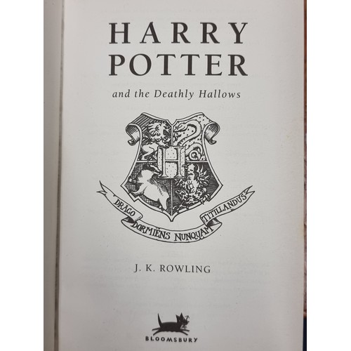 144 - A hardback first edition of Harry Potter and the Deathly Hallows by J.K Rowling. In good condition. ... 