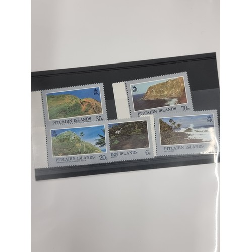 152 - An organised stamp binder filled with 25 superb sets of mint stamps from the  remote Pitcairn Island... 