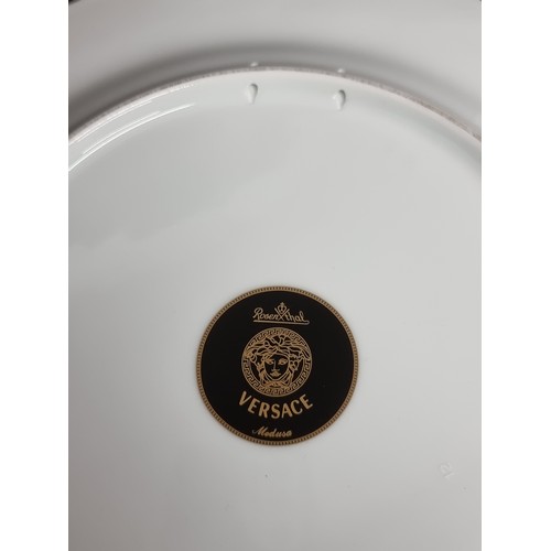 189 - A collectable porcelain plate by Rosenthal for Versace, featuring the iconic Medusa mask in bold col... 