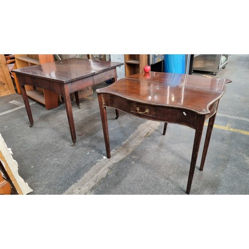 362 - Two Edwardian mahogany tables including a serpentine fronted example. Both with folding table tops a... 