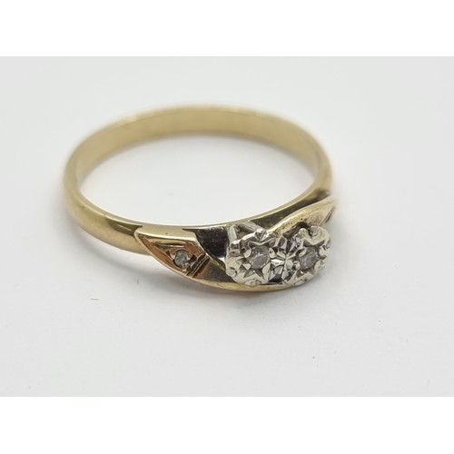 418 - A 9K gold twist set diamond ring. Ring size N 1/2, weight 1.8g.