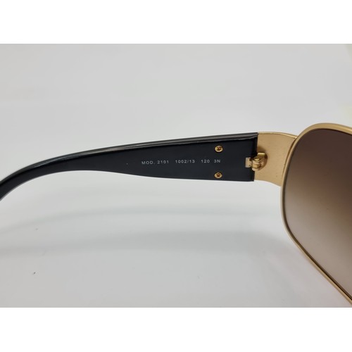 421 - A good pair of original  Versace, made in Italy, wraparound style sunglasses. Lenses in good order. ... 