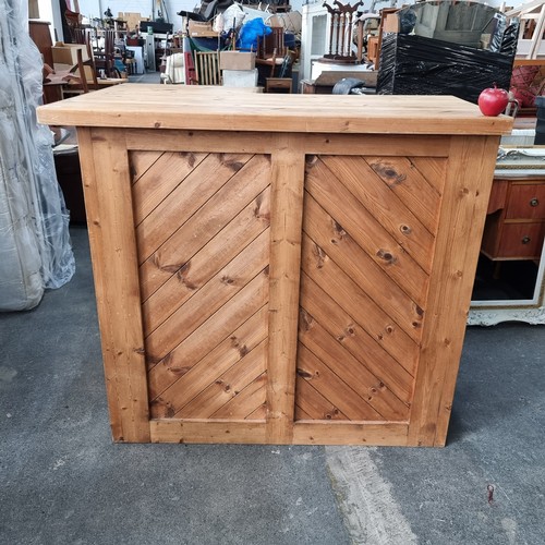 683 - A pine finished home bar with L-shaped storage underneath. Would be great for outside.