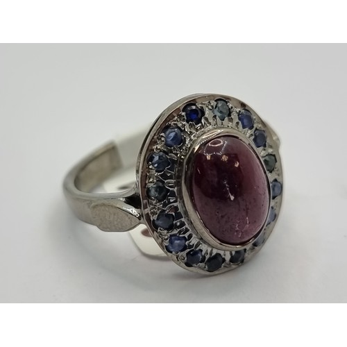 455 - An attractive ruby and sapphire ring. Weight of ruby 3cts, sapphires amount to 0.35cts in total. Rin... 