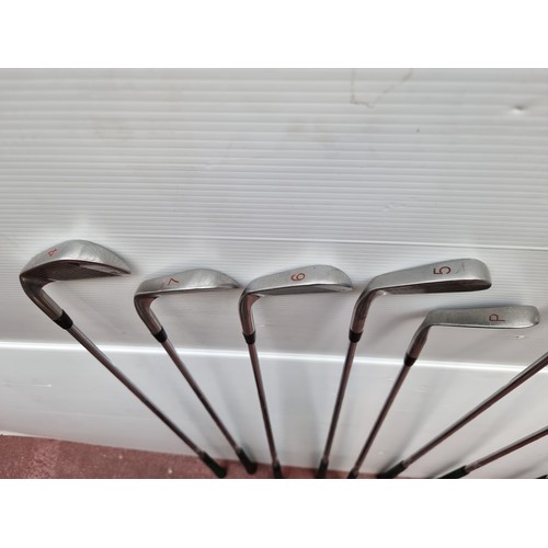 463 - A set of Special Edition Golf Clubs including a full set of irons, a strater putter and three woods.... 